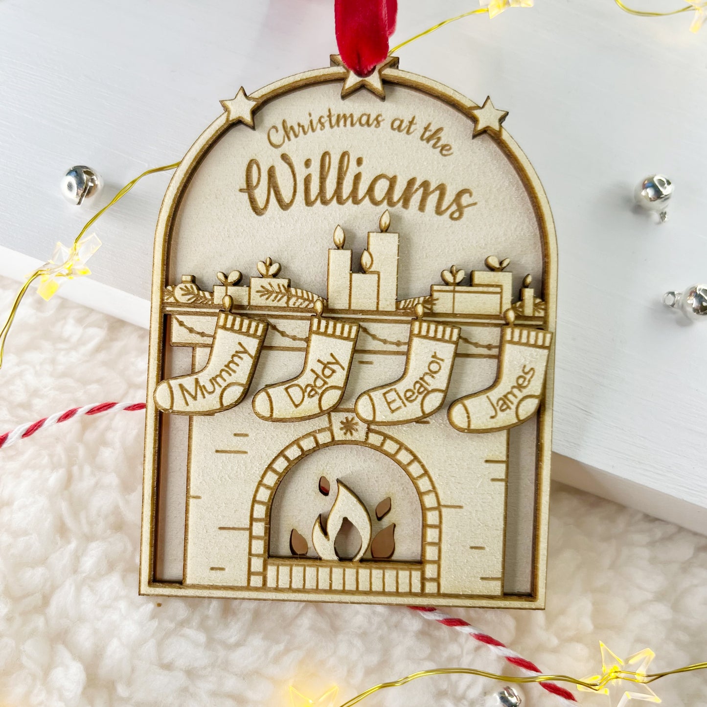 Wooden family christmas decoration with personalised miniature stockings.