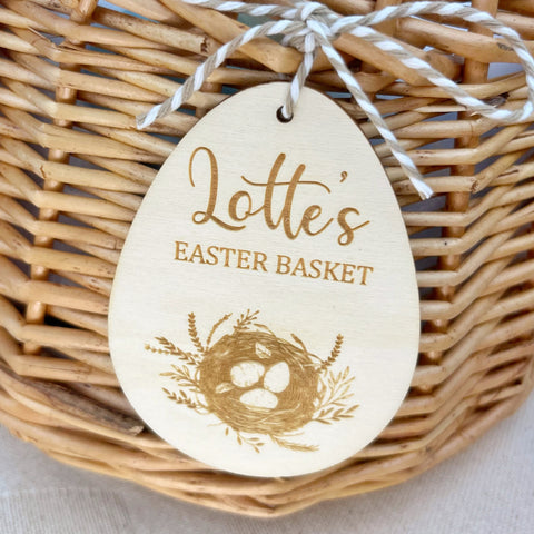 Engraved wooden egg shaped decoration, a lovely personalised Easter basket tag gift. Made by The Bespoke Workshop