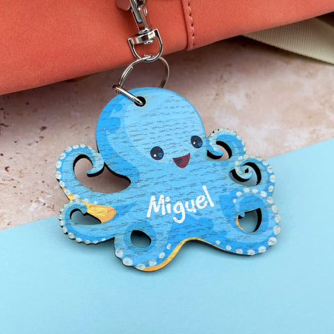 Cute wooden octopus childs keyring, UV printed printed and personalised with a name. The Bespoke Workshop