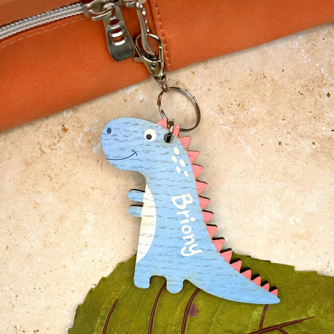 Wooden dinosaur keyring, colour printed on wood and personalised with a childs name. Made by The Bespoke Workshop