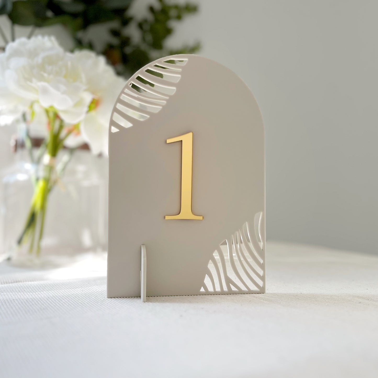 Elegant laser cut arched mirrored table numbers for weddings by The Bespoke Workshop