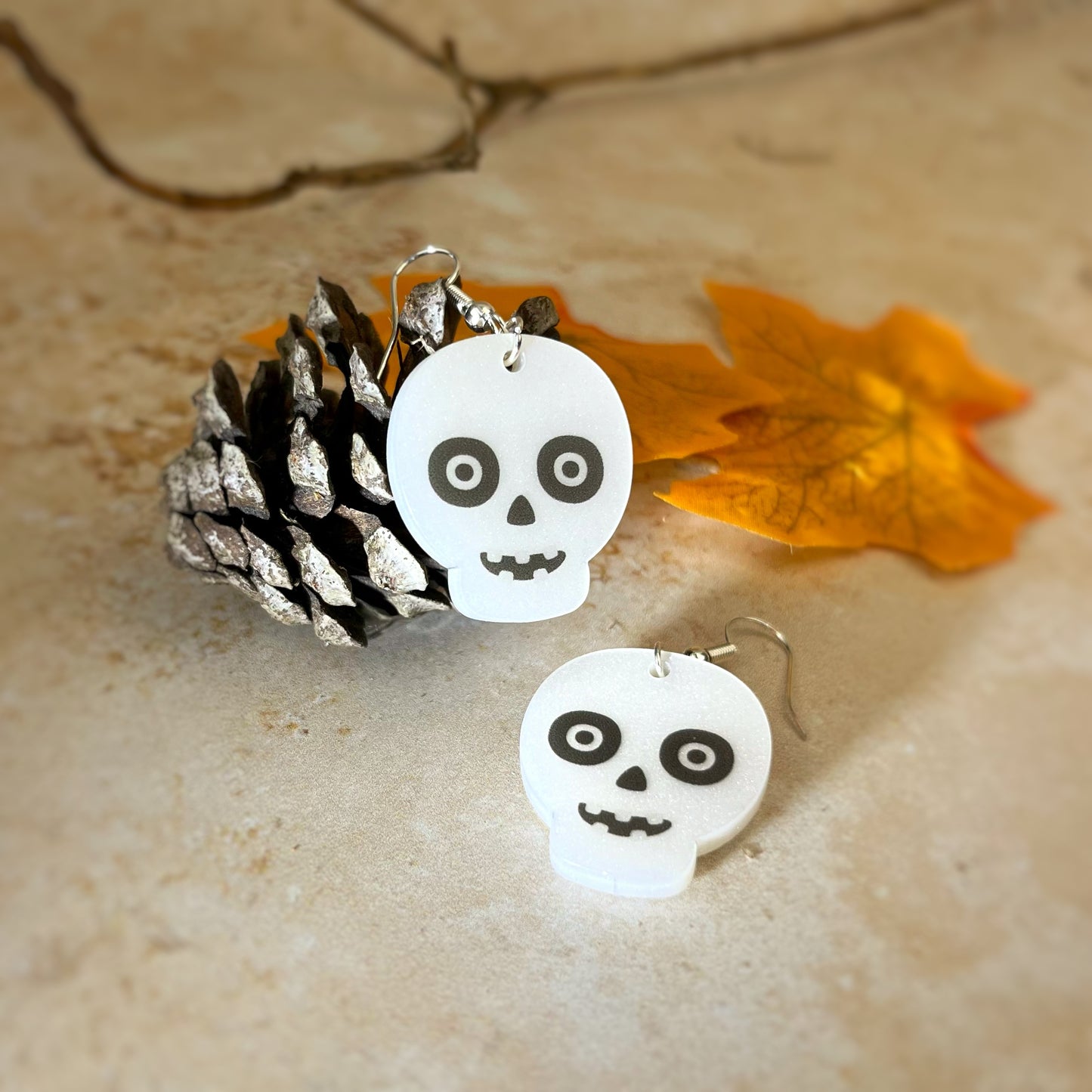 Acrylic skull earrings. Laser cut and UV printed by The Bespoke Workshop