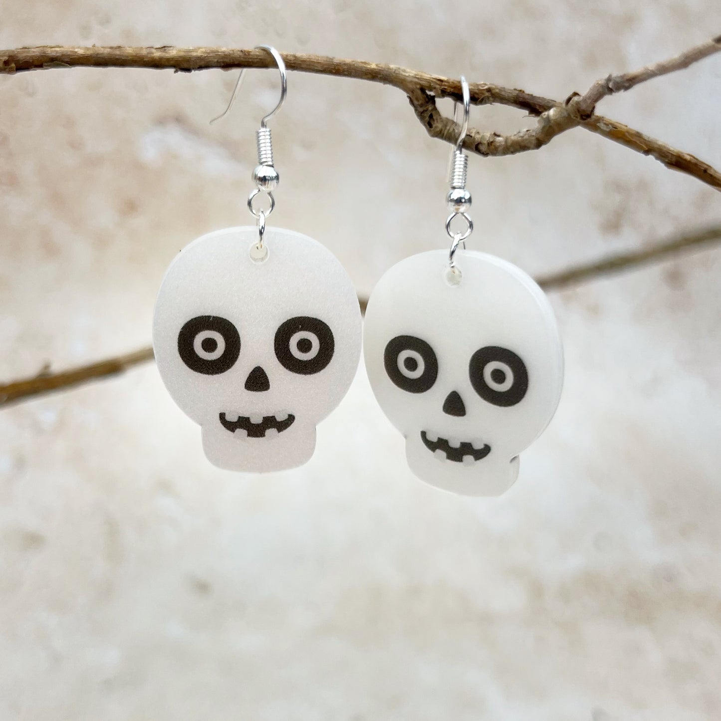 Laser cut and UV printed cute acrylic skull earrings. Designed and made by The Bespoke Workshop