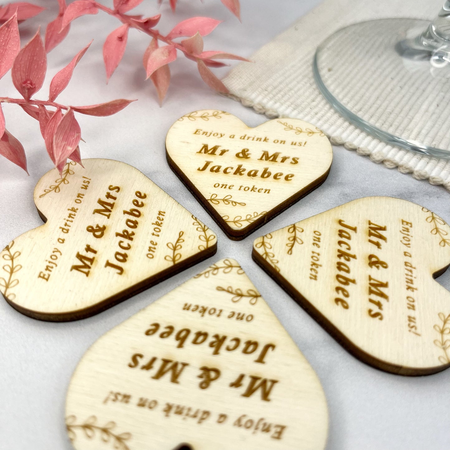 Heart shaped free drinks wedding tokens can be personalised by engraving the couples names by The bespoke workshop