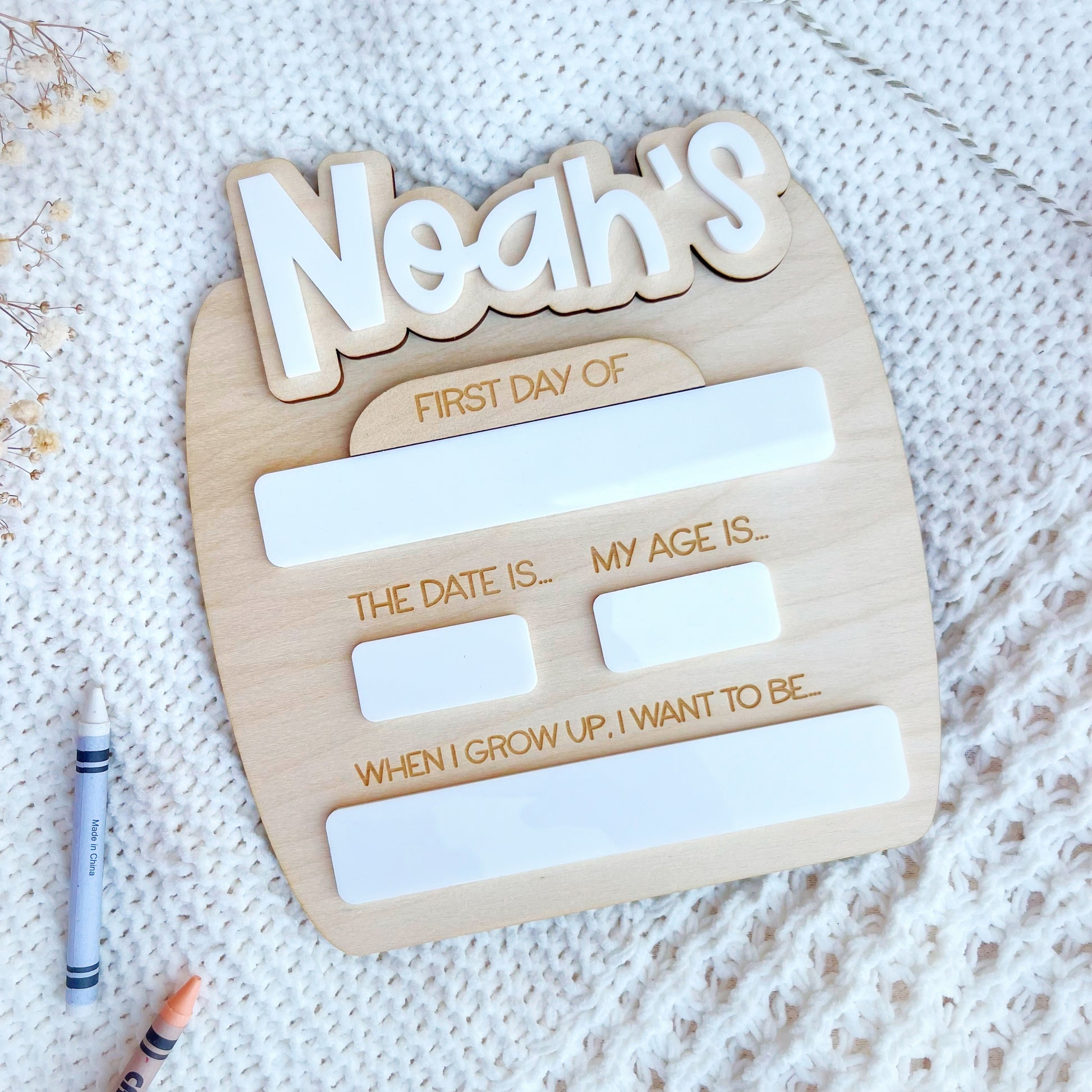 Custom made photo board for a child to hold on their first day of school or nursery. Made from wood and the name is made from white acrylic. The Bespoke Workshop