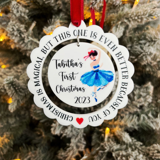 Babys first Chrsitmas decoration, personalised with a name and a dancing balerina. Printed on white acrylic featuring a scalloped laser cut edge. The Bespoke Workshop