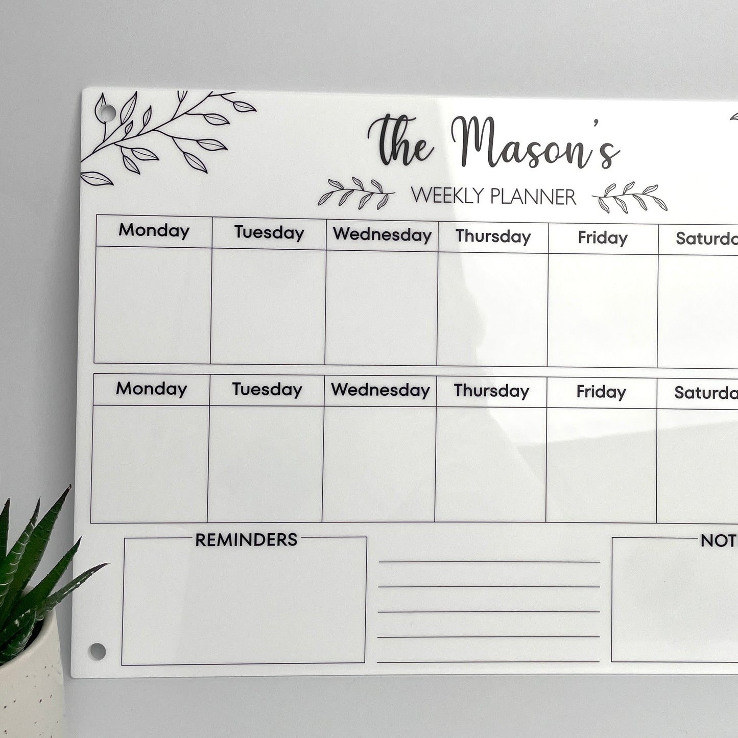 Weekly planner with 'The Mason's' personalised name at the top - white acrylic with black text 